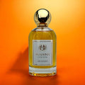 OUD GHAZNAVI perfume bottle by YAADUNA London with golden cap on orange background