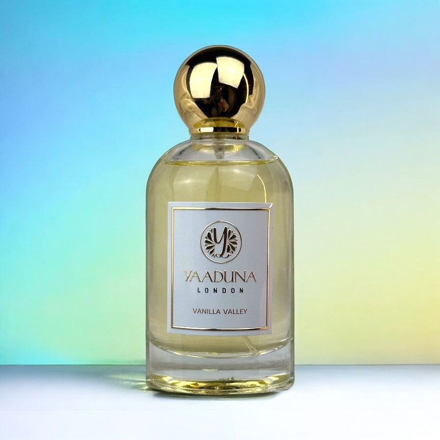 Vanilla Valley perfume bottle with gold cap and elegant label on gradient background